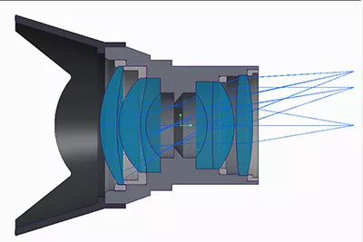 Ansys Speos のCAD環境。鑑筒や機构部品を含むレンズアセンブリの断面と、内部を通る光線を示しています